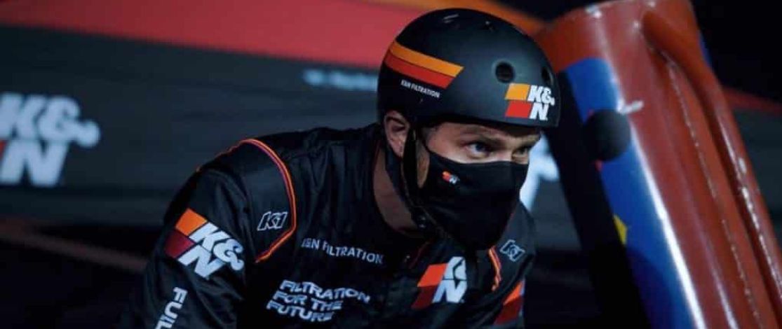 Motor Bike Racer at the starting line with a helmet about to race