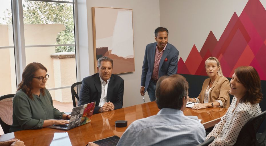 Office meeting with CEO looking over lead management Office meeting with CEO looking over lead management
